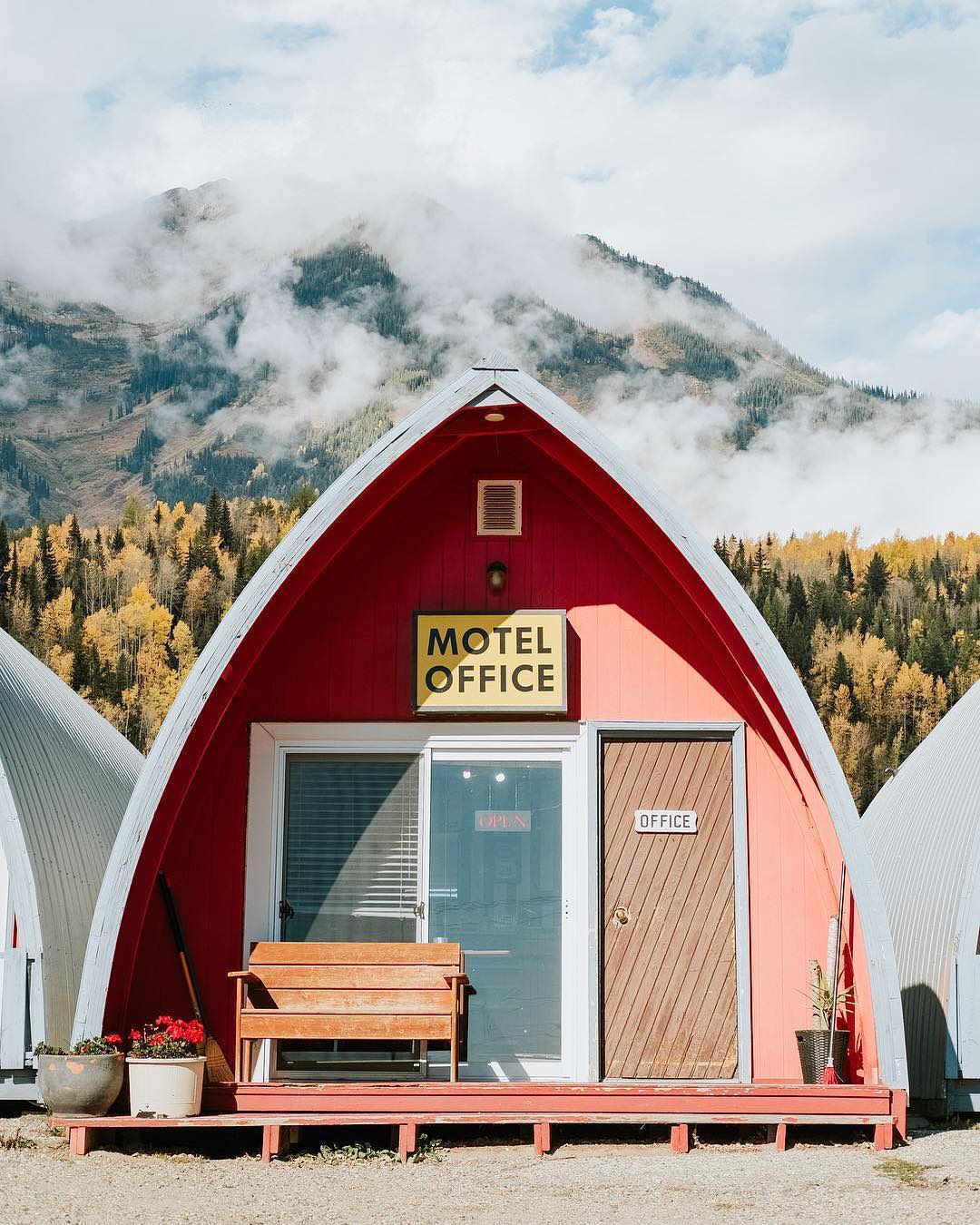 Photo from the book Accidentally Wes Anderson by Wally Koval, depicting a small motel office. The photo is in pastels, and shot from straight on, replicating many images from Wes Anderson films.