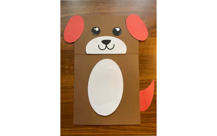 Make a dog puppet from a paper bag.